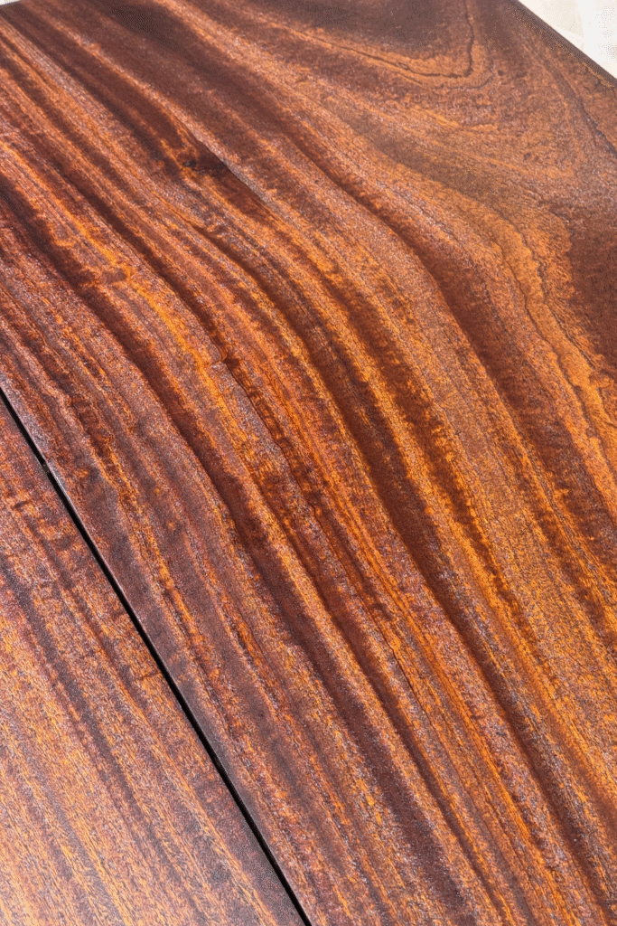 chatoyancy top of an antique mahogany tabletop